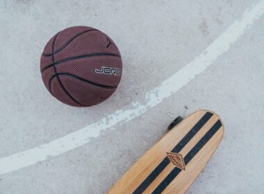 a skateboard and a basketball on the ground