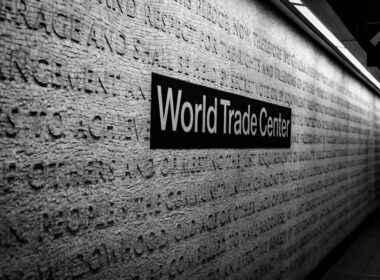 a black and white photo of a world trade center sign