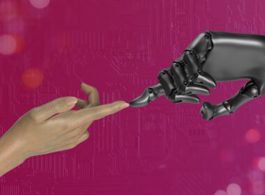 two hands touching each other in front of a pink background