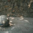 white and blue soccer ball on gray concrete floor