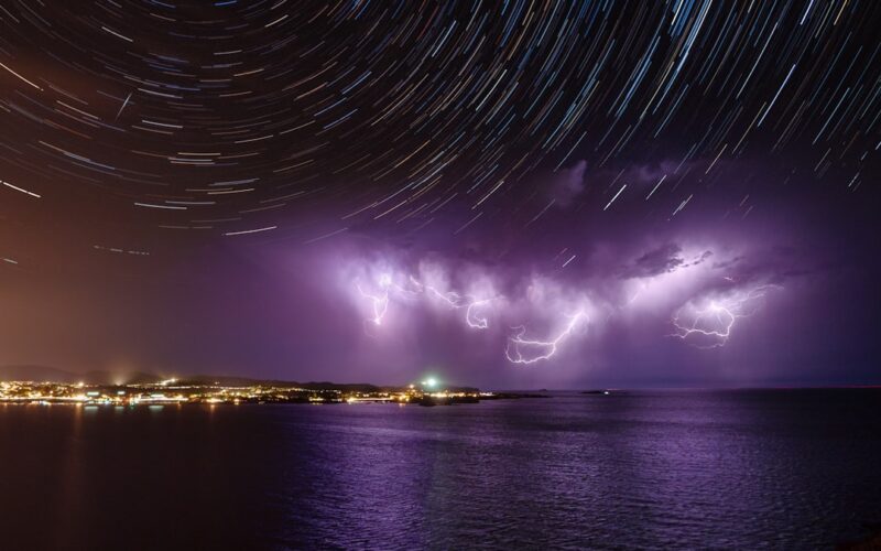 blue lights on body of water during night time