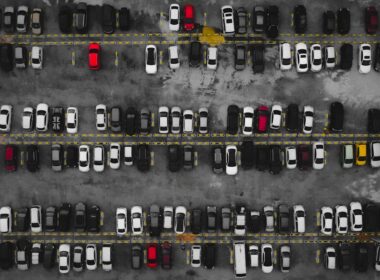 a parking lot filled with lots of parked cars