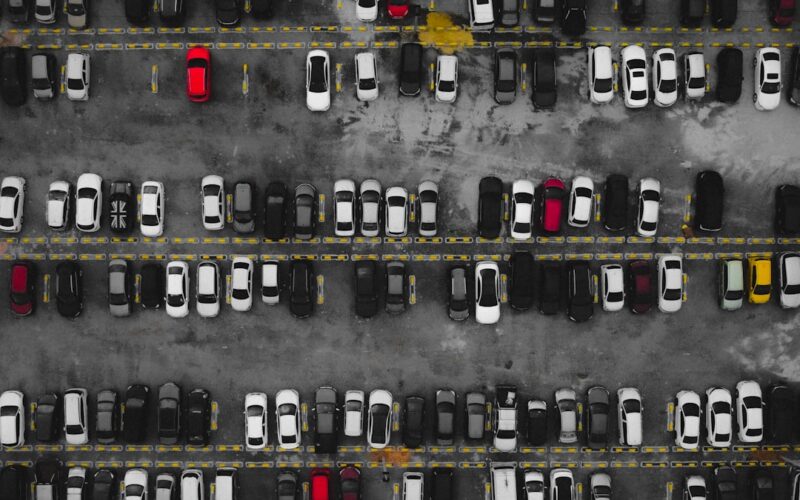 a parking lot filled with lots of parked cars