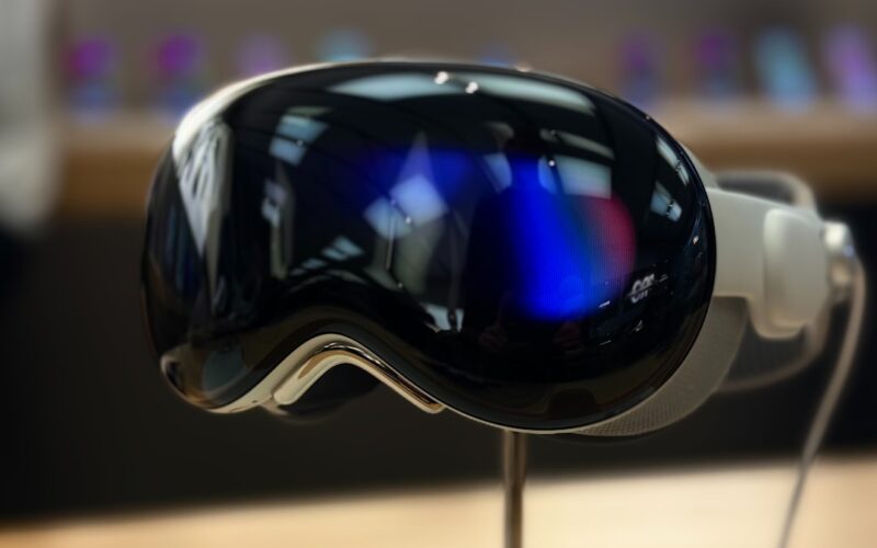 A pair of ski goggles sitting on top of a wooden table