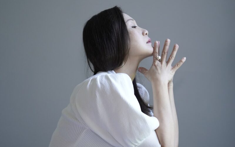 woman in white knit sweater