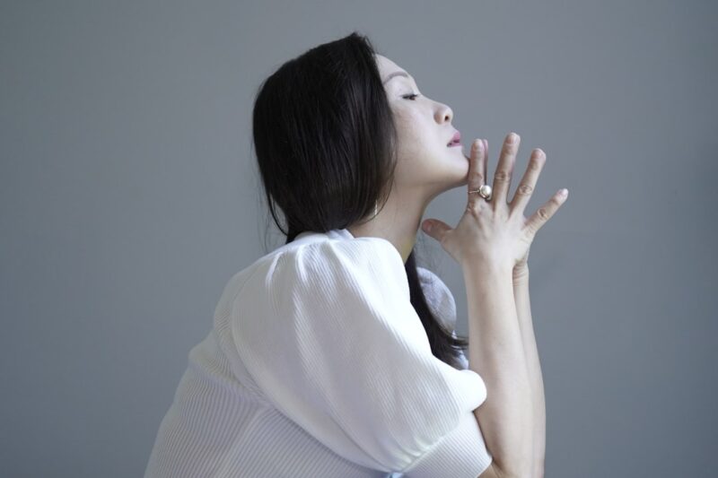 woman in white knit sweater