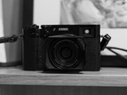 a black and white photo of a camera on a table