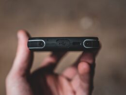 person holding black flash drive