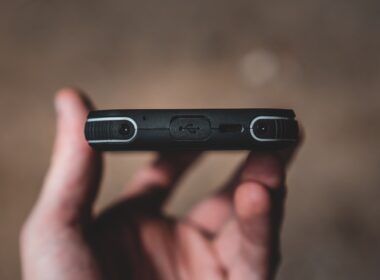 person holding black flash drive