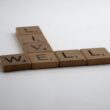 brown wooden letter blocks on white surface