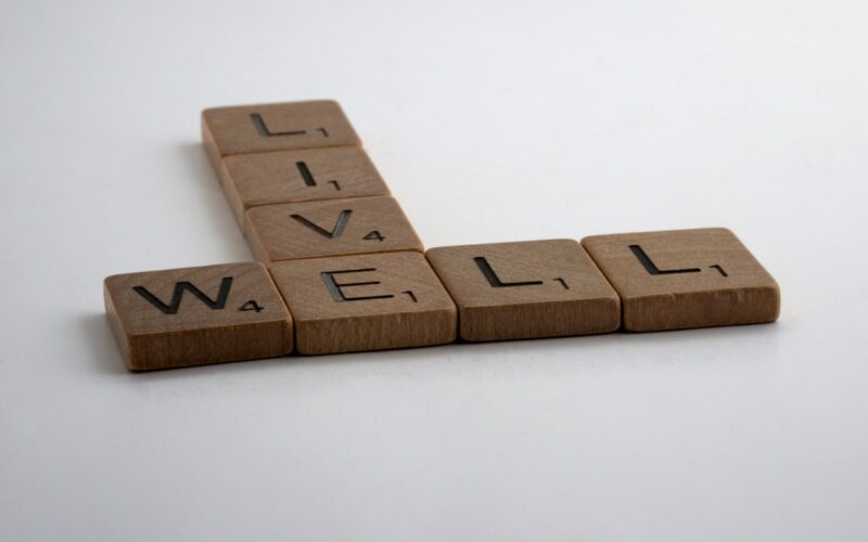 brown wooden letter blocks on white surface