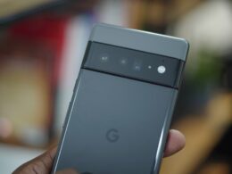 a hand holding a cell phone