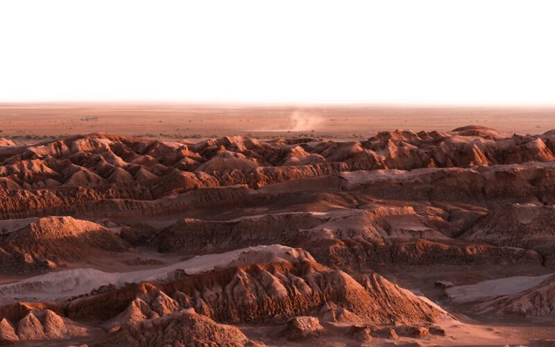 A view of a desert with rocks and sand