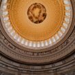 The capitol building's dome is seen from within.