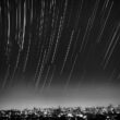 grayscale photo of meteor shower
