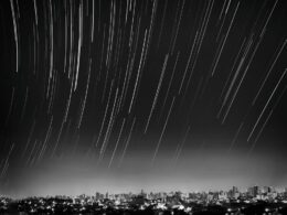 grayscale photo of meteor shower