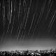 grayscale photo of meteor shower