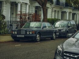 a row of parked cars on a city street
