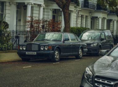 a row of parked cars on a city street