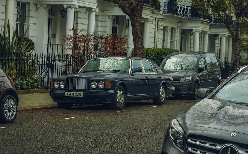 a row of parked cars on a city street