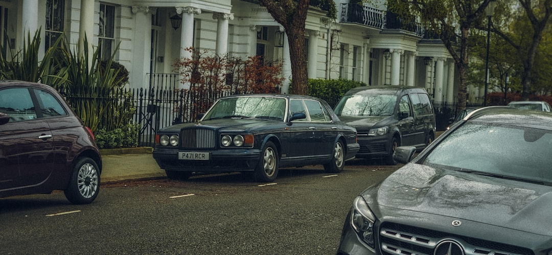 a row of parked cars on a city street