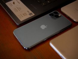 silver ipad on brown wooden table