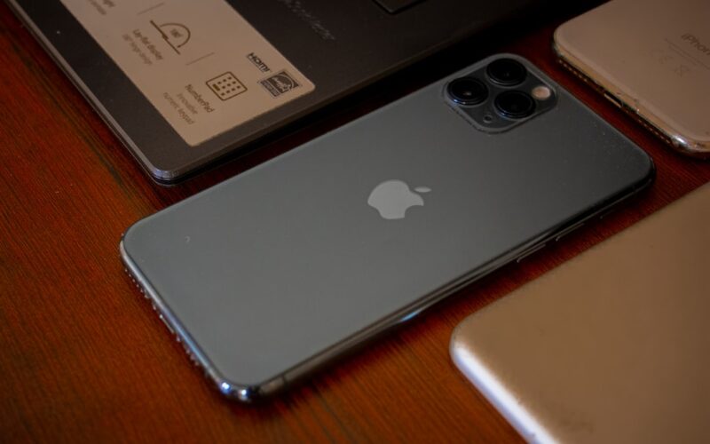 silver ipad on brown wooden table