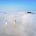 white clouds over white tower