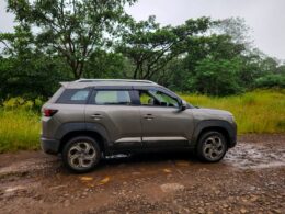 A car is parked on a muddy road