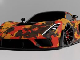 an orange and black sports car on a gray background