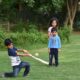 2 boys playing golf during daytime