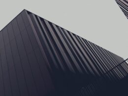 a couple of tall buildings next to each other