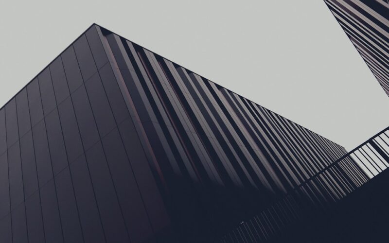 a couple of tall buildings next to each other