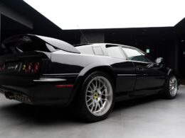 a black sports car parked in a garage