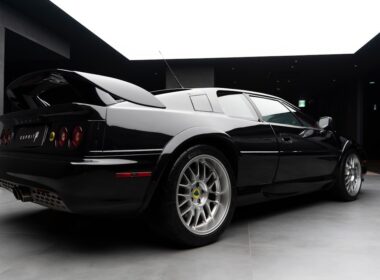 a black sports car parked in a garage