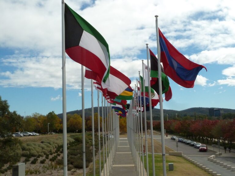 white red and green flags on white metal poles