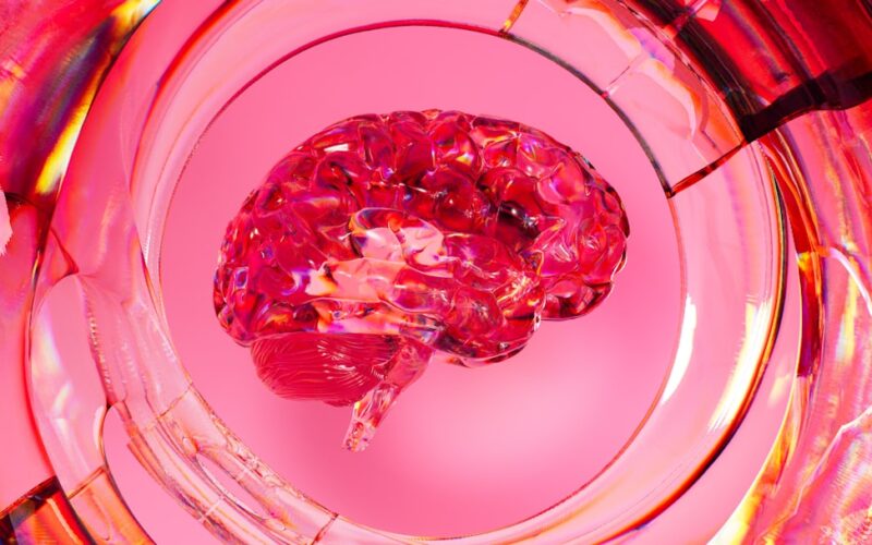 A close up of a glass with a pink substance in it