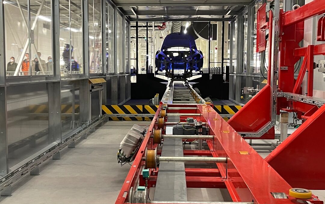 a car being built in a large factory