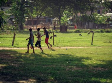 a group of people playing baseball