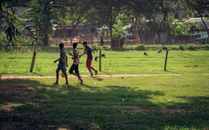 a group of people playing baseball