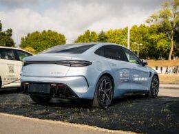 Two cars parked on the side of the road
