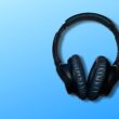 black corded headphones on blue background