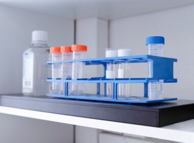 Test tubes and bottle on a shelf