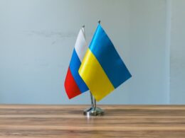 Russian and ukrainian flags on a table
