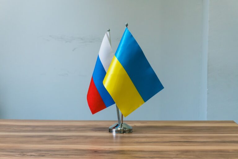 Russian and ukrainian flags on a table
