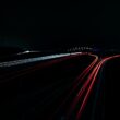 a long exposure photo of a highway at night