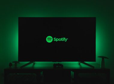 the spotify logo is lit up on a flat screen tv