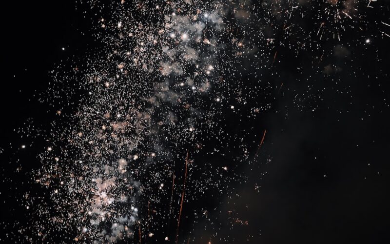 a bunch of fireworks are lit up in the night sky