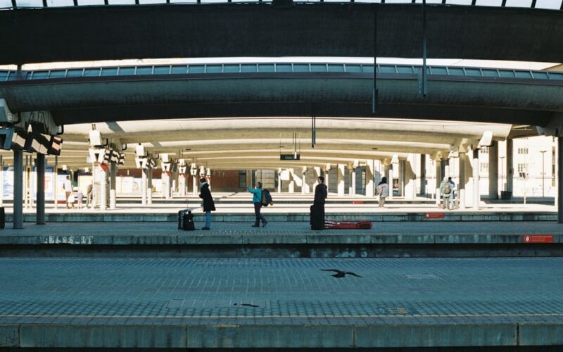 a group of people standing on top of a train platform