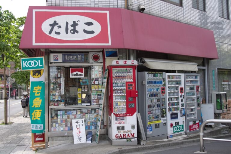 A small convenience store with cigarette and drink vending machines.
